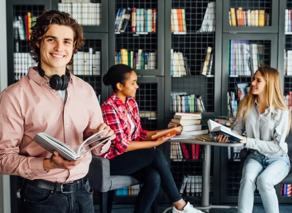 three students in library